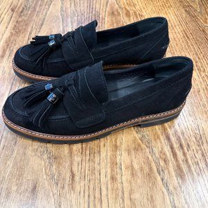 Stuart Weitzman Manila Black Suede Loafer with a double tassel detail.